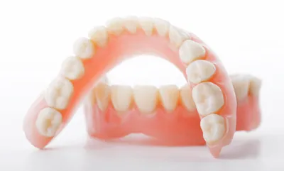 Полные и частичные акриловые съемные зубные протезы: плюсы и минусы,  изготовление и установка