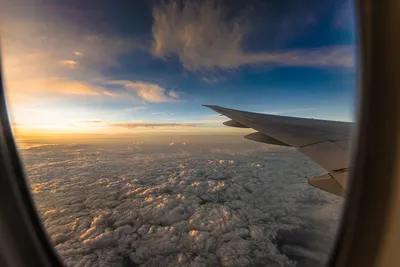 Фотография Крыло самолёта Самолеты Иллюминатор окна летит Облака