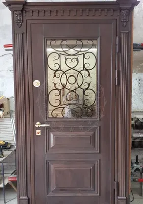 Входная дверь со стеклом и ковкой ЭДМ-644 - купить от производителя по цене  от 138000 руб. в Москве. Цены, изготовление на заказ, установка