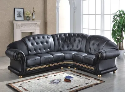 Угловой черный кожаный диван с декоративными элементами. Классика