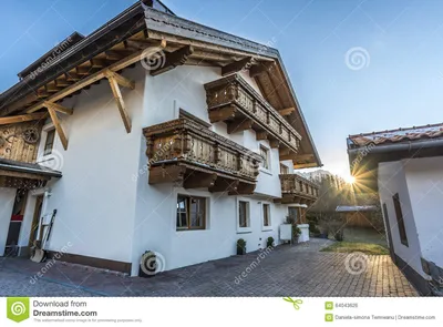 Австрийский дом с деревянными балконами Стоковое Фото - изображение  насчитывающей галиматью, резиденция: 64043626