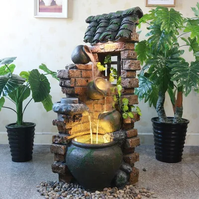 Декоративный фонтан для квартиры: мини фонтанчики в интерьере помещения
