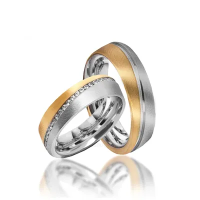Обручальные кольца из комбинированного с дорожкой камней на заказ из белого  и желтого золота, серебра, платины или своего металла