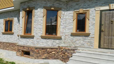Облицовка фасада дома искусственным камнем своими руками