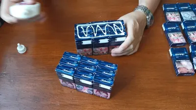 Робот с секретом из пачек сигарет - YouTube