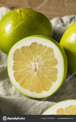 Wooden basket with whole and cut sweet ripe pomelo fruits on table ::  Стоковая фотография :: Pixel-Shot Studio