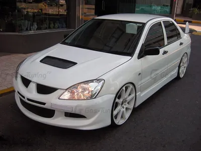 Тюнинг от TuningMyCar. Накладки на внешние пороги Mitsubishi Lancer 9