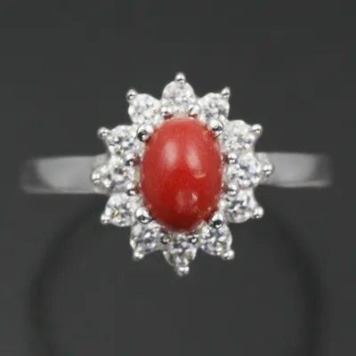 Купить дизайнерское кольцо с красным янтарем в позолоченном серебре \"коралл\"