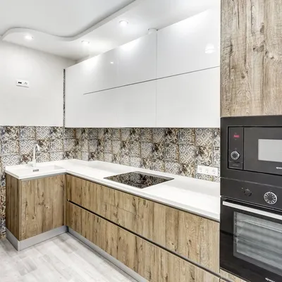Белая угловая кухня с пластиковыми фасадами в стиле Хай-Тек c акриловой  столешницей за 356000 рублей от Кухнидар. Фото и проектная документация