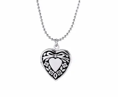Подвески :: Кулоны из серебра :: Стильный кулон-сердце из серебра и янтаря  зелёного цвета «Санрайз»