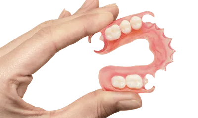 Съемные зубные протезы: виды, материалы и цены