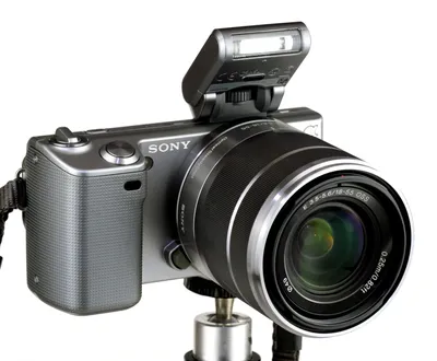 Sony Alpha NEX system - NEX-5 with zoom lens, and attachable flash folded  down in off position Stock Photo - Alamy