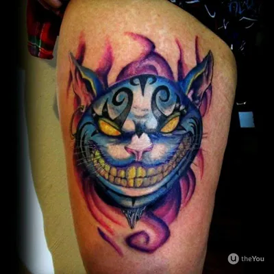 фото цветной женской татуировки на руке в стиле реализм чеширский кот и  часы / Тату салон «Дом Элит Тату»