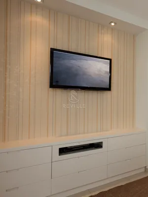 Белая подвесная тумба под ТВ в современном стиле в гостиной из ЛДСП - на  заказ в Москве
