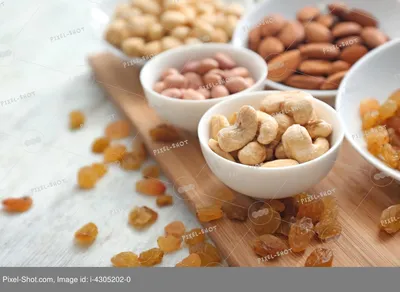 Различные виды орехов и сухофруктов на столе :: Стоковая фотография ::  Pixel-Shot Studio
